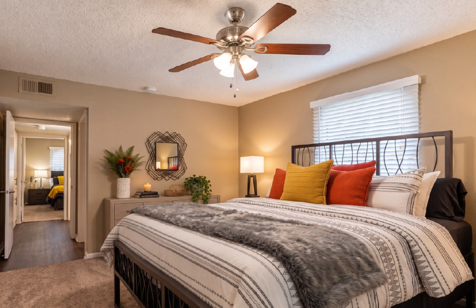 Bedroom with a ceiling fan at Fairways 5